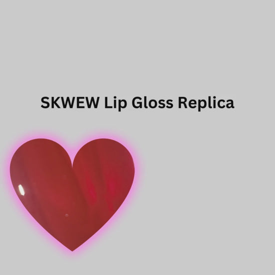 Fire Kiss Lip Gloss. The color SKWEW gives a deep luster pink glow. The lip gloss is packaged with an illuminating applicator wand that lights up when the lip gloss is applied.